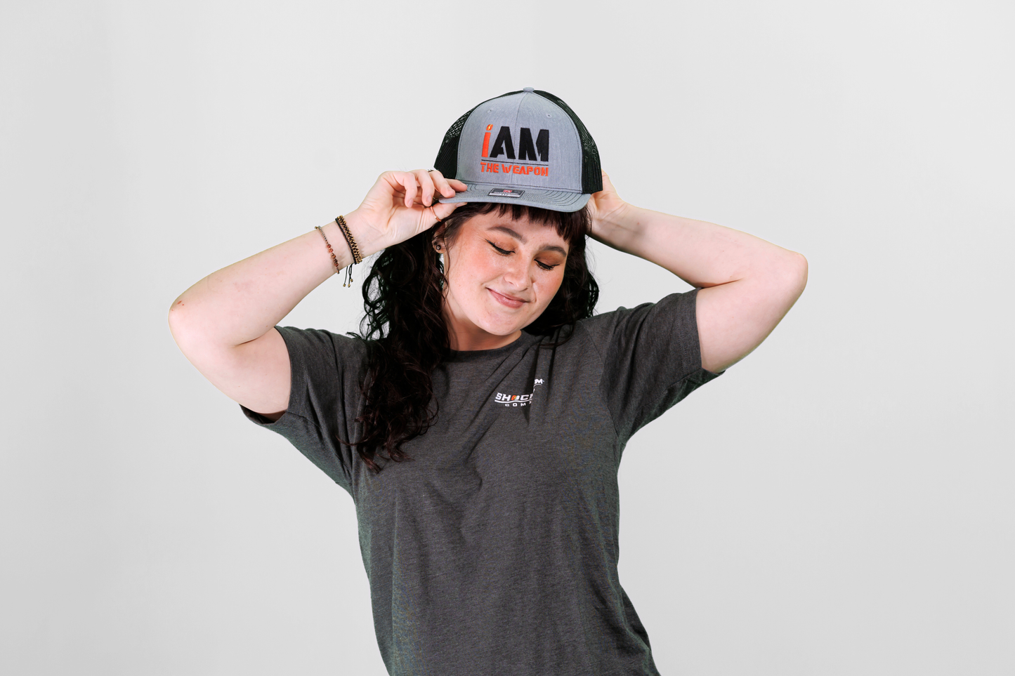 I Am the Weapon Trucker Hat
