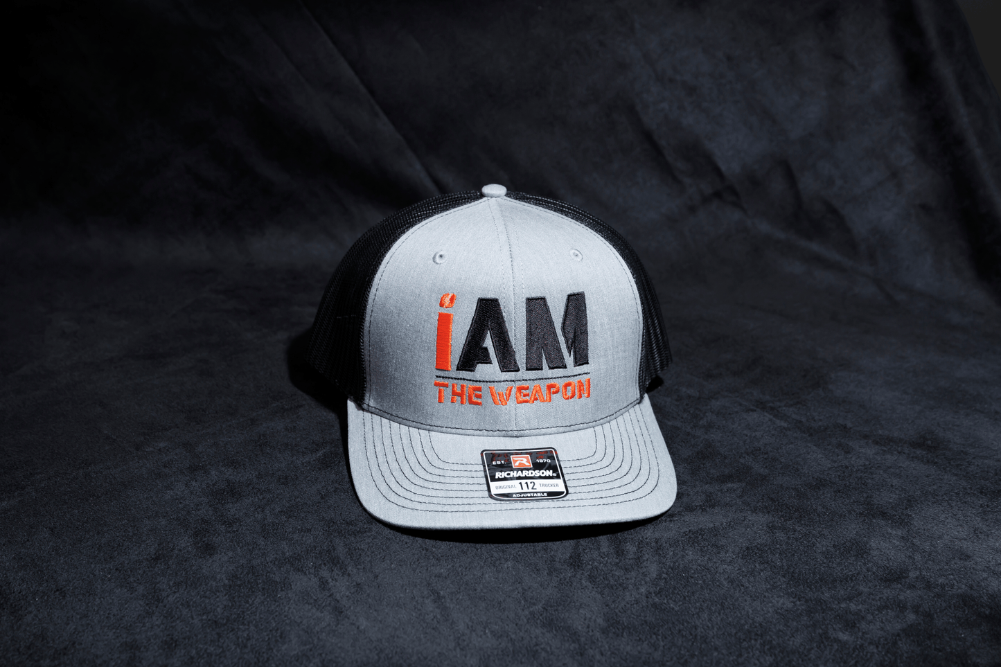I Am the Weapon Trucker Hat